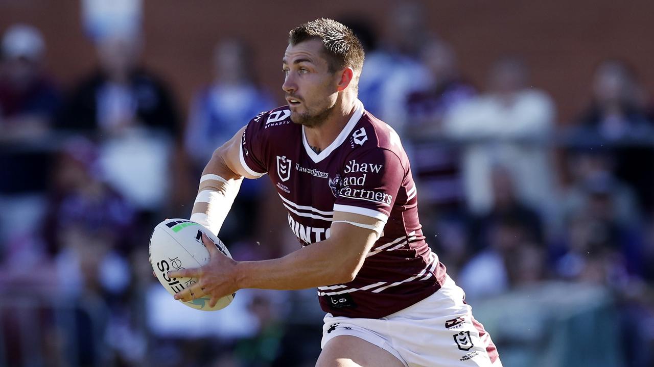 Kieran Foran insists Tom Trbojevic of the Sea Eagles runs with the ball during the round nine NRL match between the Manly Sea Eagles and the Wests Tigers at 4 Pines Park, on May 07, 2022, in Sydney, Australia. (Photo by Mark Evans/Getty Images)