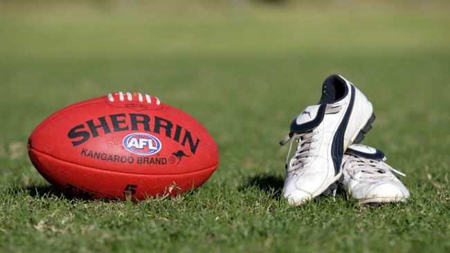 Generic AFL Sherrin football and football boots. sport /