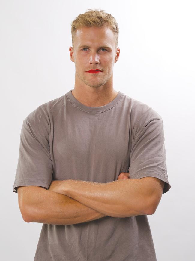 Australian Ironman Jett Kenny dons red lipstick to support women's mental health after the tragic loss of his sister Jaimi. Picture: Supplied