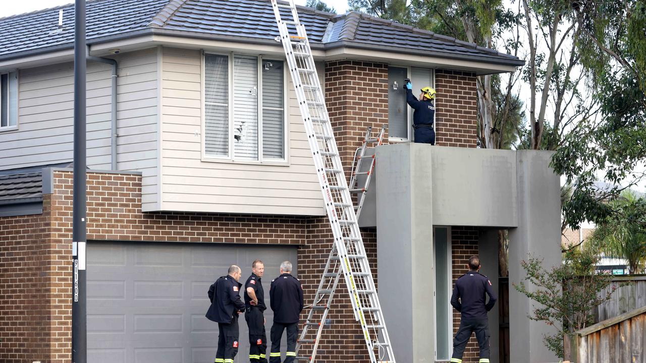 Forensics units analysed bullet holes on a house on Steeple Place in Marsden Park after a drive by shooting last night. Picture: NewsWire / Damian Shaw