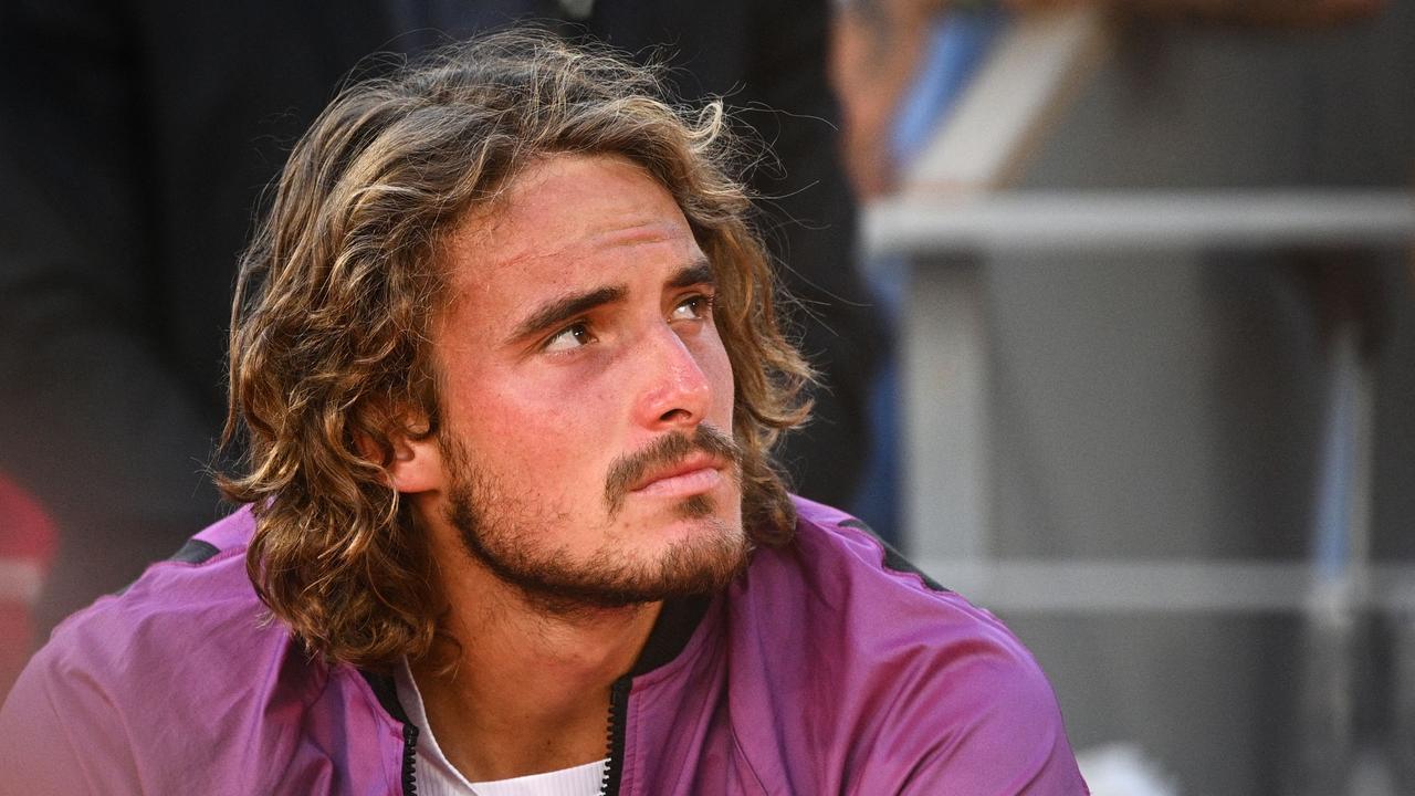 Greece's Stefanos Tsitsipas reacts after losing his men's final tennis match against Serbia's Novak Djokovic on Day 15 of The Roland Garros 2021 French Open tennis tournament in Paris on June 13, 2021. (Photo by Anne-Christine POUJOULAT / AFP)