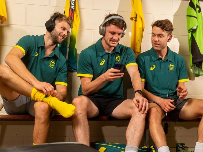 The Kookaburras are in Darwin for training before heading off to Japan for the 2020 Olympics. Josh Beltz, Dylan Martin and Flynn Ogilvie warm up with some tunes in the changerooms before heading out in the Darwin heat. Picture: Che Chorley