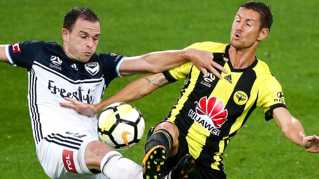Melbourne Victory’s Leigh Broxham (left) and Wellington’s Nathan Burns compete for the ball.