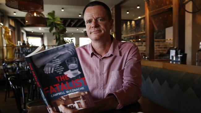 Campbell McConachie poses with his book The Fatalist at the Burwood Hotel where he met Lindsey Rose. Picture: AAP