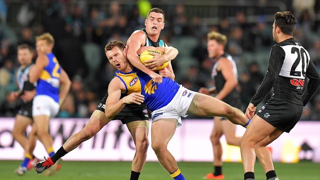 Tom Rockliff wraps up Eagle Luke Shuey. Picture: Daniel Kalisz/Getty Images