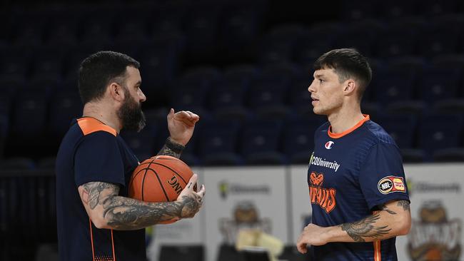 Taipans coach Adam Forde and Marshall Nelson talk before the New Year’s Eve clash with Perth. The Taipans haven’t played since. (Photo by Ian Hitchcock/Getty Images)