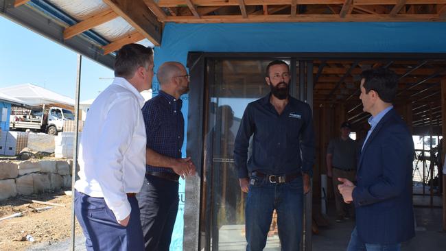 Queensland Premier David Crisafulli and JGK Builders owner John Kay discuss the abolishment of stamp duty in Yeppoon alongside Keppel MP Nigel Hutton and Treasurer and Minister for Home Ownership Minister David Janetzki.