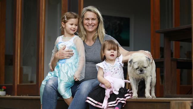 Libby Trickett poses with her daughters Poppy, 4, and Edwina, 18 months in Brisbane in September 11, when she was 30 weeks pregnant with her third child. Picture: AAP/Claudia Baxter