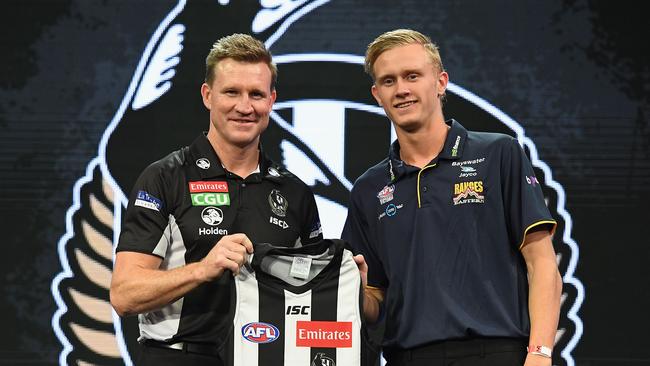 Jaidyn Stephenson with coach Nathan Buckley after being drafted to the Magpies.