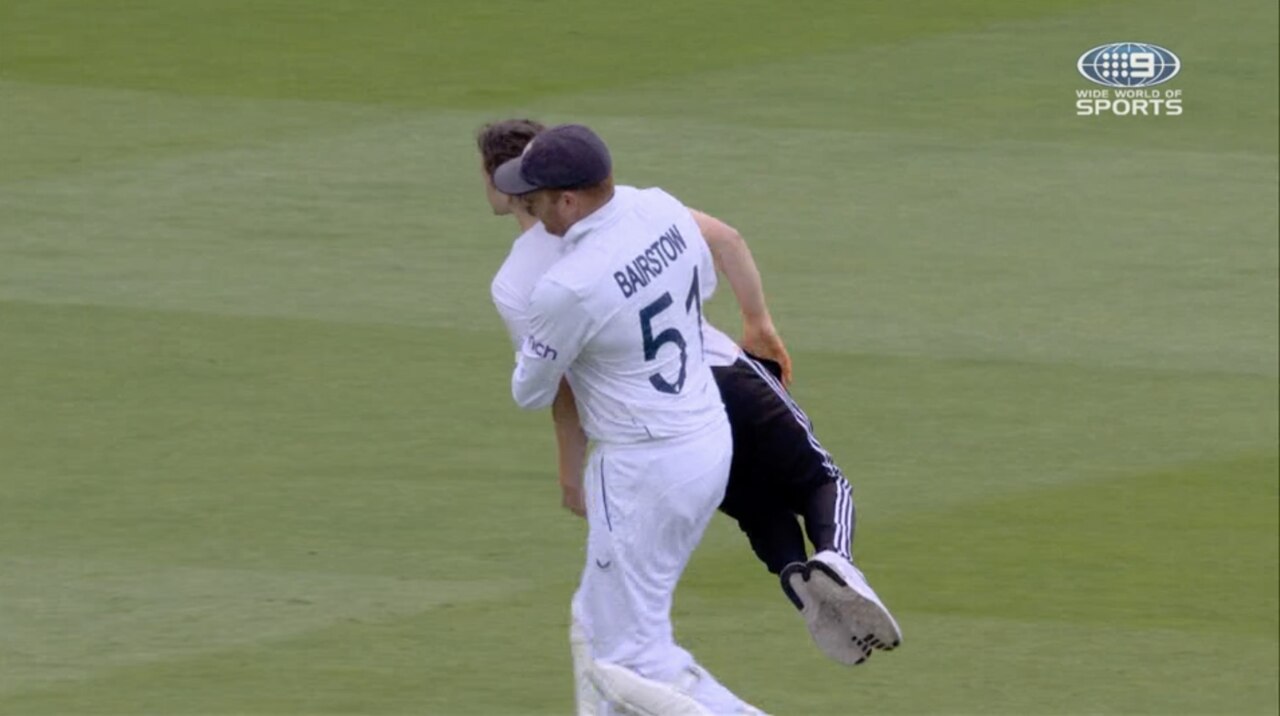 Jonny Bairstow carries a pitch invader off Lord's.