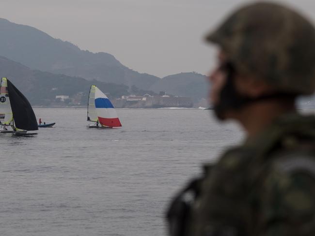 Brazilian marines patrol Flamengo Beach, near the site that will host the sailing competitions of the Rio 2016 Olympic Games. Picture: Christophe Simon