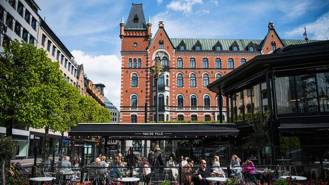 People sit in a restaurant in Stockholm amid the coronavirus COVID-19 pandemic. Picture: AFP