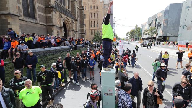 One worker gets up to inspire the crowds. Picture: Alex Coppel