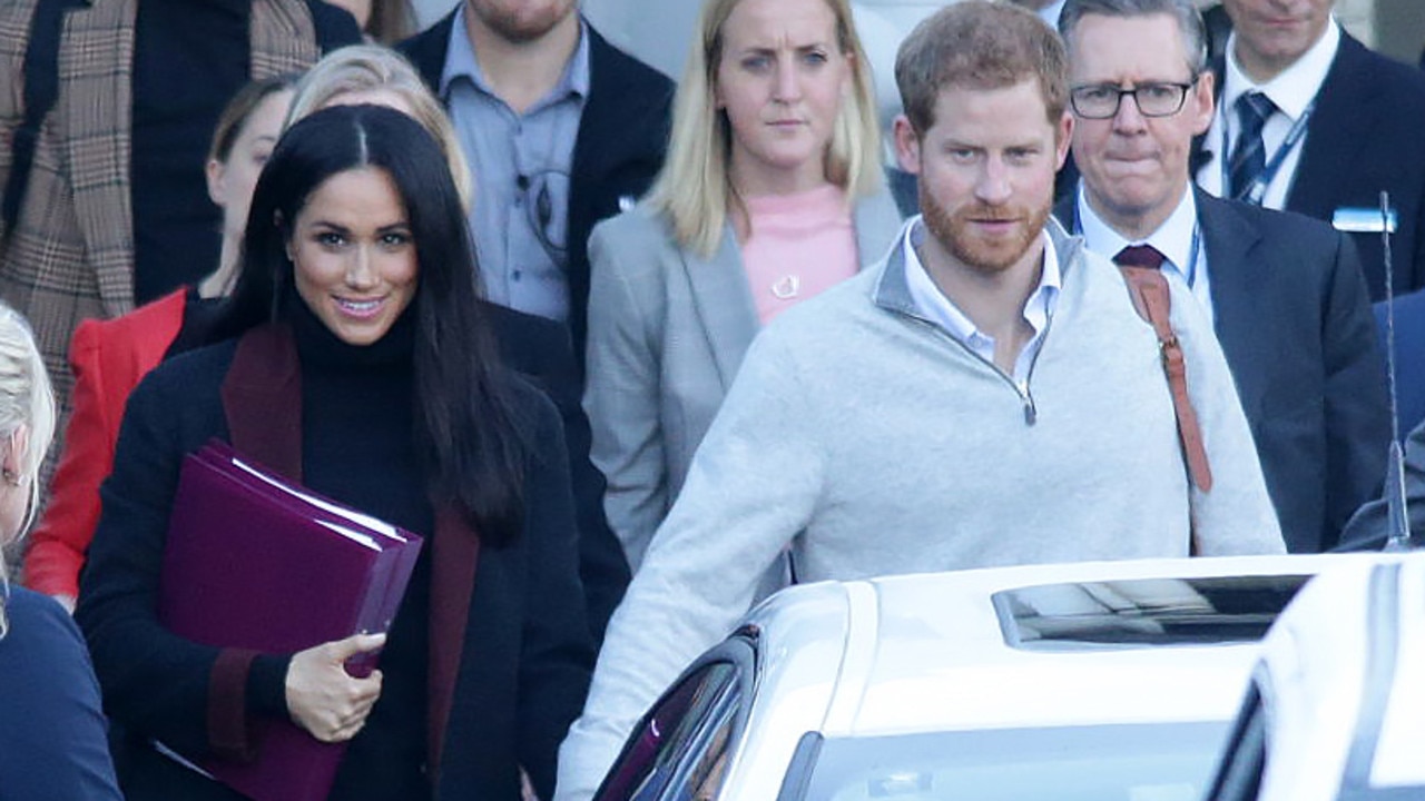 The Duchess of Sussex was clutching two folders in a classic bump-hiding move. Picture: www.matrixpictures.com.au