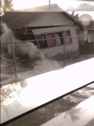 Screen grabs from footage of a church in Tonga when the tsunami hit. Twitter/Johnnyteiser