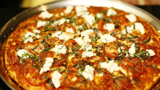 A family-sized Caponata pizza, featuring eggplant, capsicum, fresh tomato, onion, ricotta, basil, garlic and cheese, available from Cugini at Bellerive Quay. Picture: MATT THOMPSON