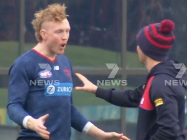 Clayton Oliver is seen arguing with a trainer at training.