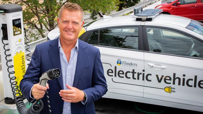 Flinders Uni vice-chancellor Colin Stirling at an electric vehicle charging point on campus. Picture: Serena Findlay