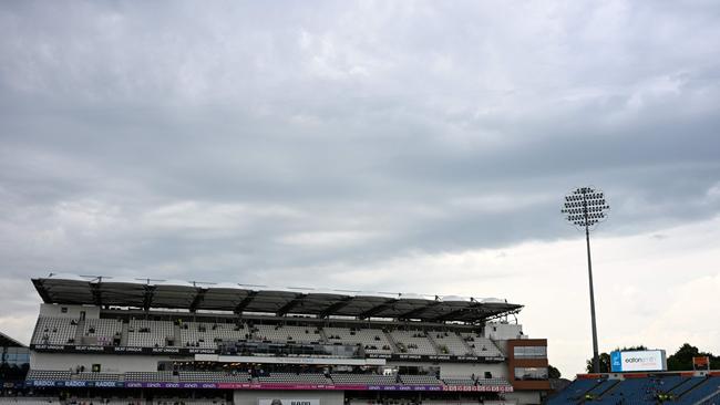 Not promising: The covers are on as the rain starts on day three of the Headingley Test. Picture: AFP