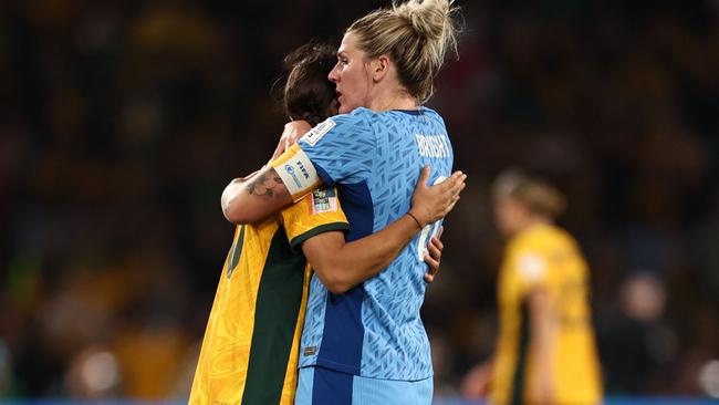 England's Millie Bright embraces Matildas captain Sam Kerr at the end of their semi-final clash. Picture: AFP