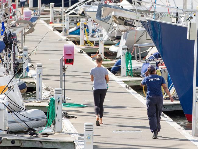 Customs officials at Port Denarau Marina in Fiji, where Shenanigans is moored. Picture: Mark Stewart