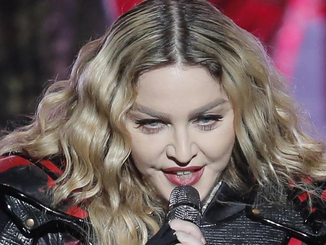 FILE - In this Feb. 20, 2016 file photo, Madonna performs during the Rebel Heart World Tour in Macau, China. Madonna says she would never perform at a concert “high or drunk” in an Instagram post early Tuesday, March 15, 2016. The pop star played off the reported rumors that she appeared drunk onstage during her current world tour. (AP Photo/Kin Cheung)