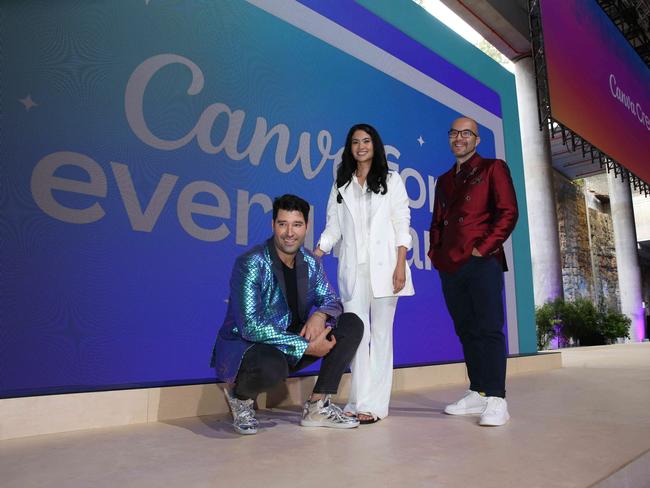 23/03/2023. Canva's co-founders Cliff Obrecht, Melanie Perkins and Cameron Adams pose for media on stage before their big 'Create' event at The Cutaway, Barangaroo in Sydney. Britta Campion / The Australian