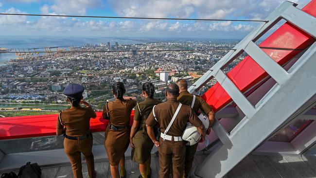 Sri Lankan police at the Sri Lankan 'white elephant' Chinese-built Lotus Tower in Colombo. Picture; AFP.