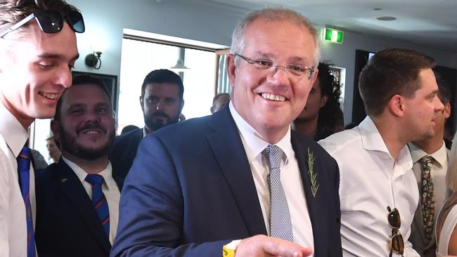 Scott Morrison greets veterans after the Anzac Day march in Townsville yesterday. Picture: AAP.