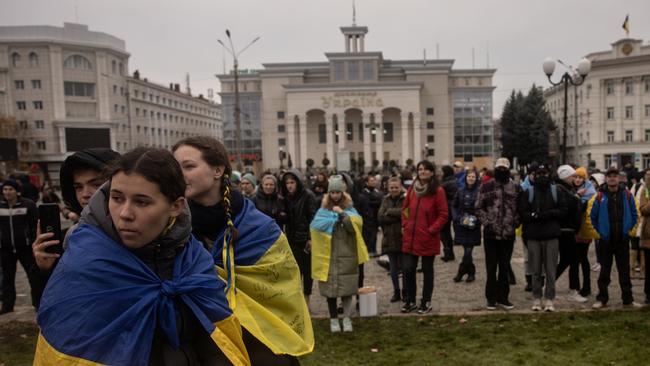 Residents listen to music during an open air concert in Kherson central square following the city’s liberation. Picture: Getty Images