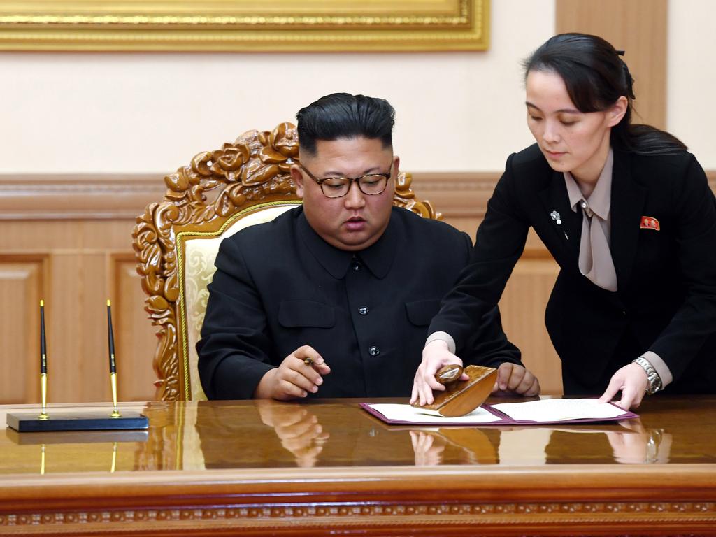 Kim Yo Jong, right, sister of North Korean leader Kim Jong-un, helps Kim sign a joint statement following the summit with South Korean President Moon Jae-in. Picture: Pyongyang Press Corps Pool via AP