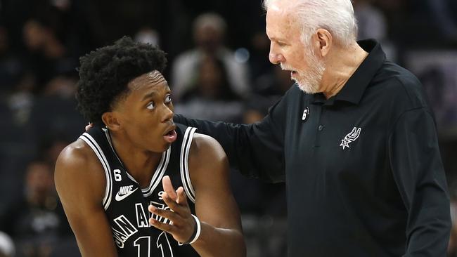 SAN ANTONIO, TX - OCTOBER 19: Josh Primo #11 of the San Antonio Spurs receives instruction from head coach Gregg Popovich in the second half at AT&T Center on October 19, 2022 in San Antonio, Texas. NOTE TO USER: User expressly acknowledges and agrees that, by downloading and or using this photograph, User is consenting to terms and conditions of the Getty Images License Agreement.   Ronald Cortes/Getty Images/AFP