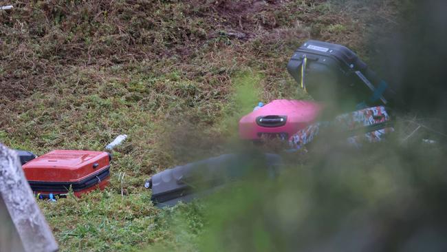 Bags were strewn across the hill where the bus crash landed. Picture: Brendan Beckett