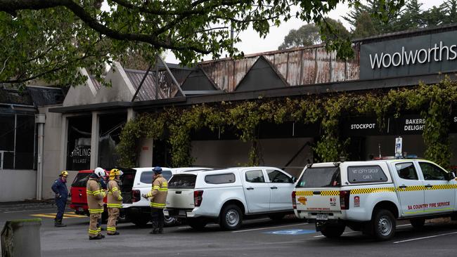 Fire investigators at the scene of the Stirling Village Shopping centre fire after it was completely destroyed. Photo: Naomi Jellicoe