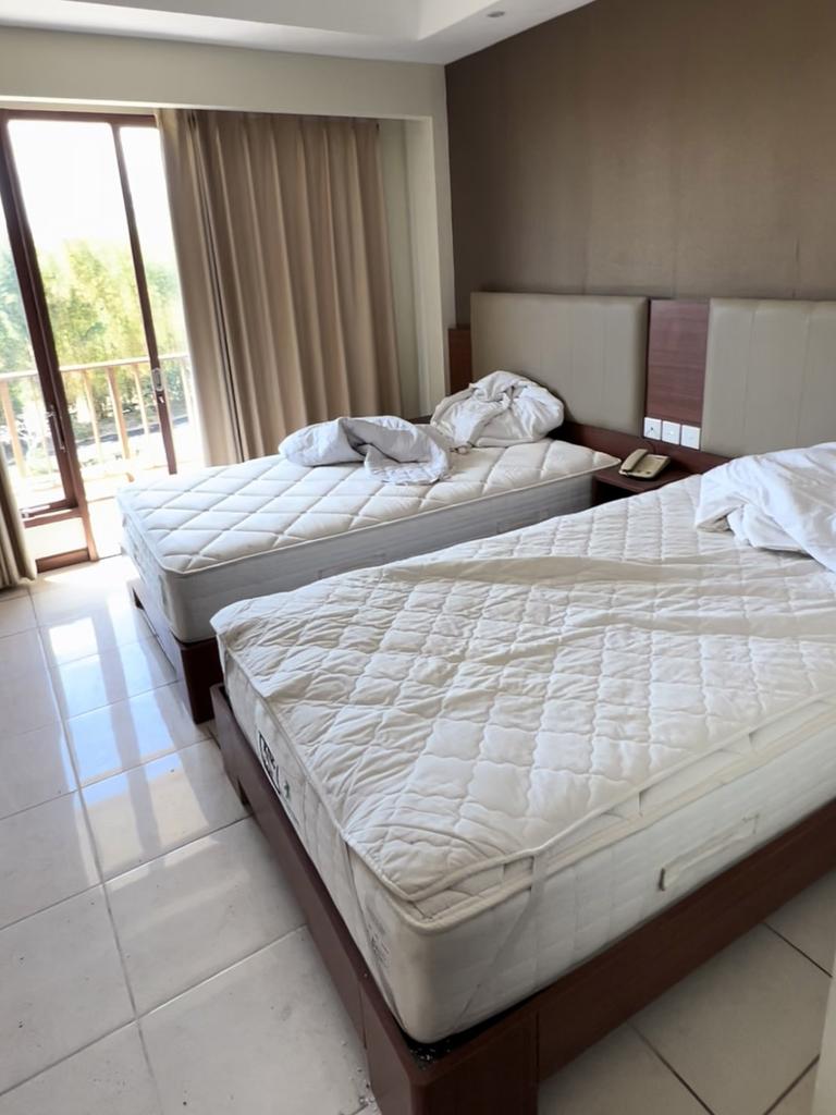 The rooms have been quickly left by hotel staff who didn’t have chance to fully clear the beds. Picture: Padesignstudio/Jam Press