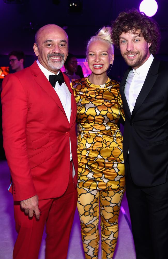 Fashion designer Christian Louboutin, Sia and producer Erik Anders Lang at the Elton John AIDS Foundation Academy Awards Viewing Party. Picture: Jamie McCarthy