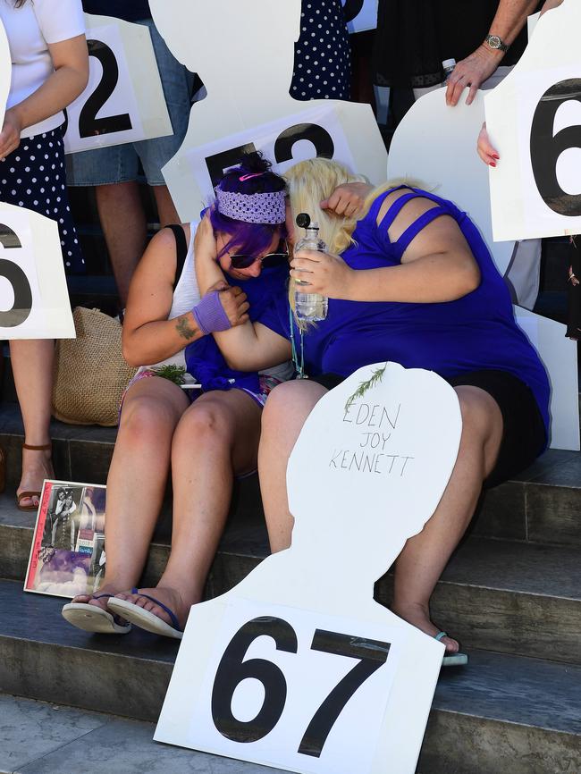 Tammy Simpson, the mother of victim Eden Kennett, is comforted by her daughter Charnna-Lee during the rally. Picture: AAP / Mark Brake