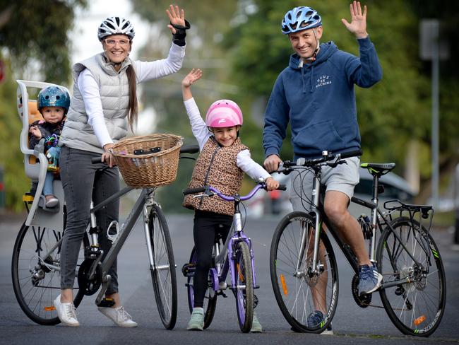 Marsha Burns and her partner Andrew Henderson with their kids Deni (14 months) and Asher (5). The family have been cycling most days during lockdown and have loved the opportunity to teach their kids about road safety while the streets have been quieter. Picture: Andrew Henshaw