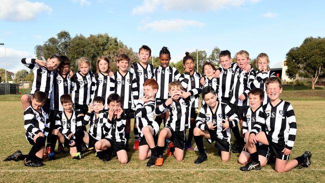 North Geelong under-9 football team pull their funniest faces.