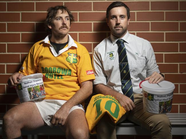 Team Captain Tom Simson and Coach Andrew Corcoran (wearing tie) from Boorowa Rugby. Mr Corcoran helped save Nathan Stapleton’s life. Club Picture Martin Ollman