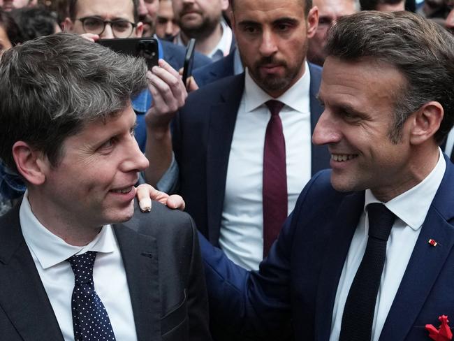 French President Emmanuel Macron (R) speaks with Sam Altman, US CEO of OpenAI at the startup campus Station F during an event on the sidelines of the Artificial Intelligence Action Summit in Paris, on February 11, 2025. (Photo by Aurelien Morissard / POOL / AFP)