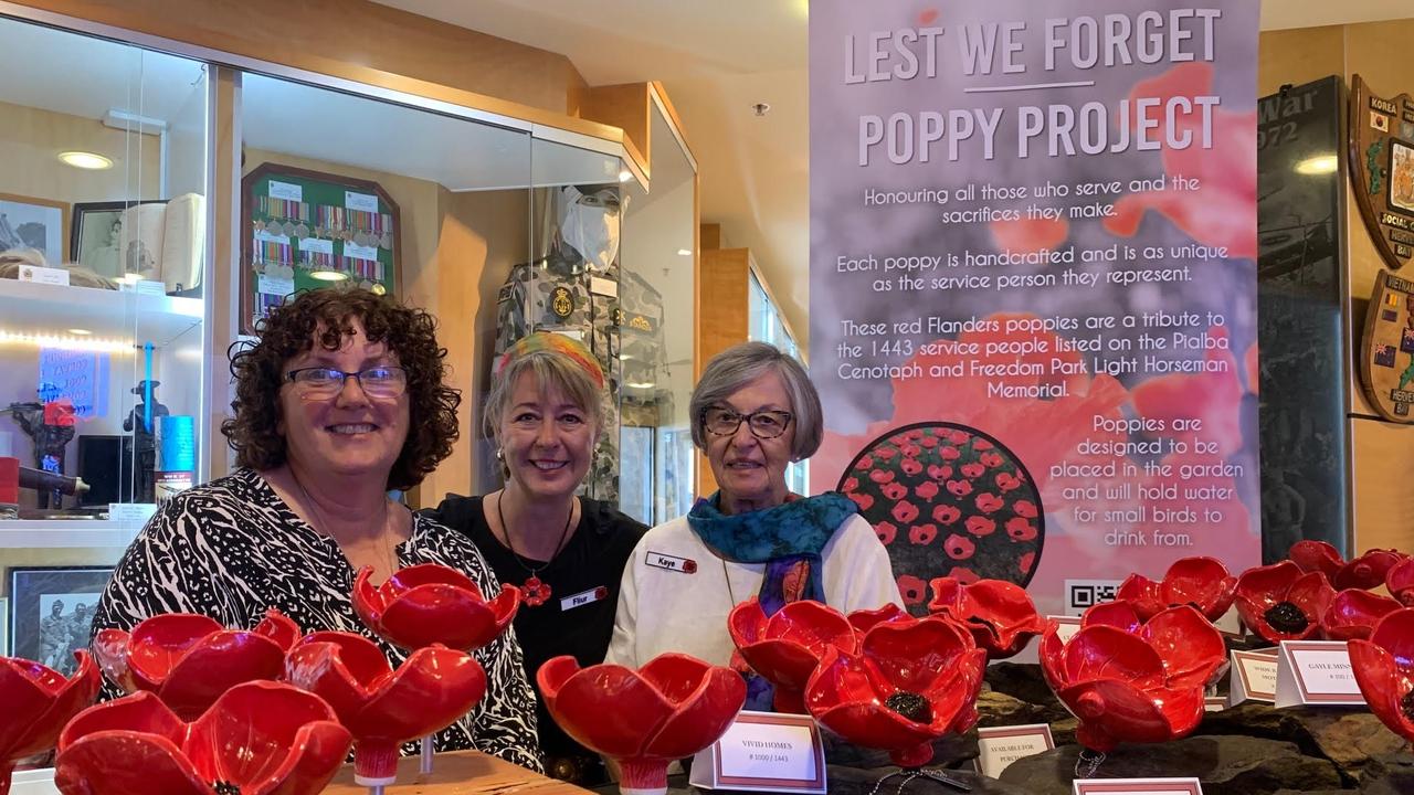 Ladies from the ‘Lest We Forget’ Poppy Project selling crafted ceramic Flanders poppies leading up to Anzac Day at Hervey Bay RSL. Photo: Kerrie Alexander.