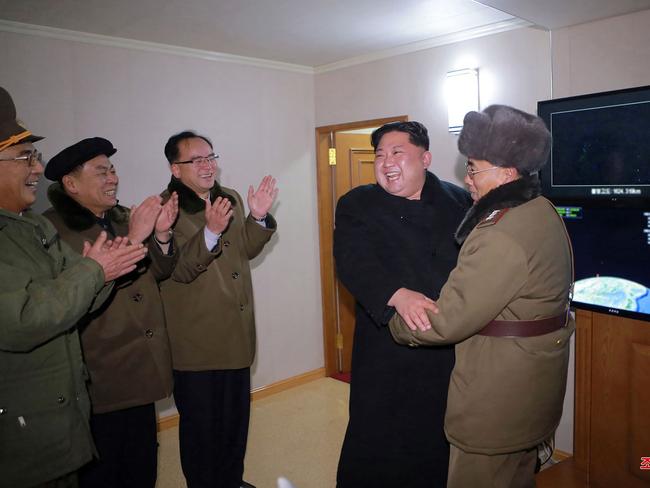 Kim Jong-un celebrates the success of his scary new weapon. Picture: AFP/Korean Central News Agency/Korea News Service