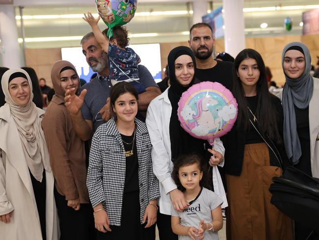 Sara and Khalil Elmasry and kids Houssum (1) and Aaliyah (4) and other family and friends pictured just after arriving at Sydney Airport after travelling from Gaza. Picture: Damian Shaw