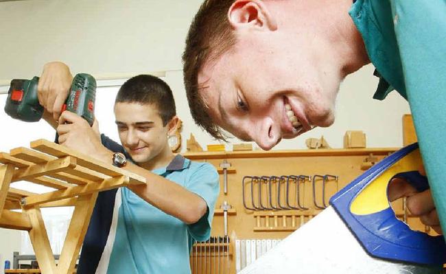 Faith Lutheran College students Michael Jones (left), 14, and Anthony Lunn, 14, hard at work. Photo: David Nielsen