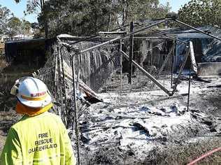 Firefighters put out a blaze in a structure behind a residence on Southerden St, Torquay. Picture: Alistair Brightman