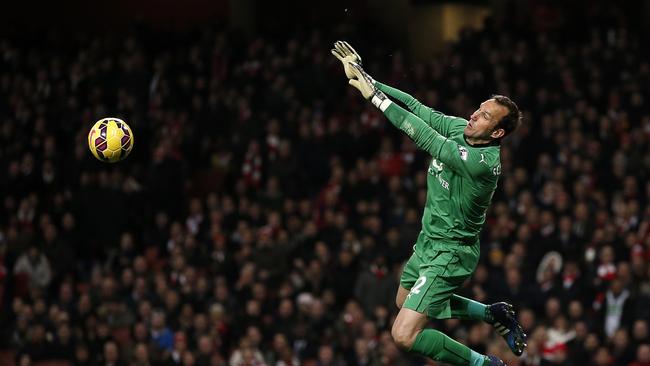 Leicester City's Australian goalkeeper Mark Schwarzer parries a shot.