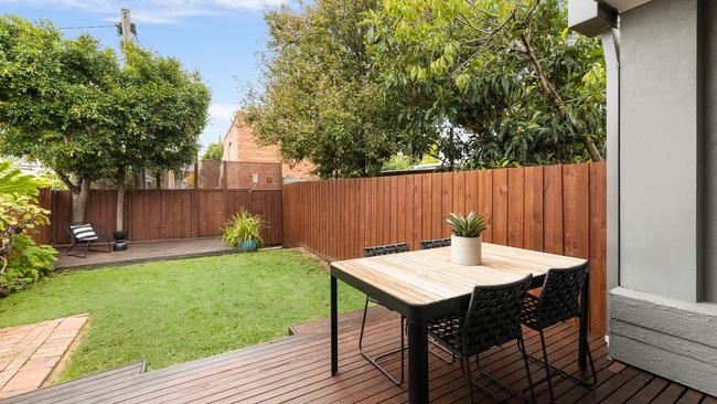 The rear garden which has two entertaining decks as well as access to Little Boundary St.