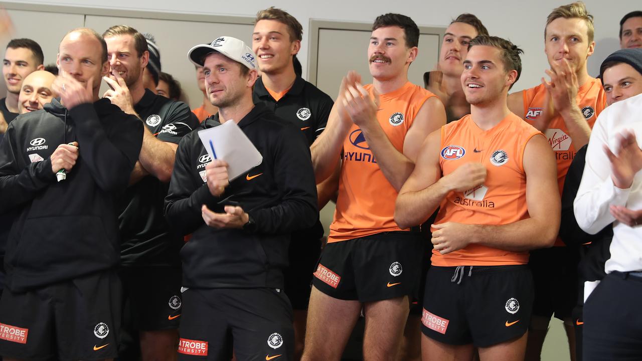 Carlton players and staff react as David Teague walks in for his press conference (Photo by Robert Cianflone/Getty Images)