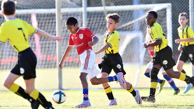 SOCCER: Junior football carnival, Maroochydore. Gold Coast Knights (red) V Moreton Bay United, boys. Picture: Patrick Woods.